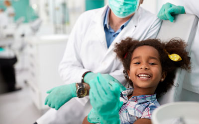 Smiling young girl at dentist